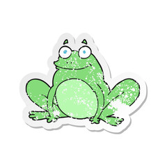 retro distressed sticker of a cartoon happy frog