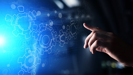 Gears mechanism on virtual screen. Automation and business process flow. Business and technology...
