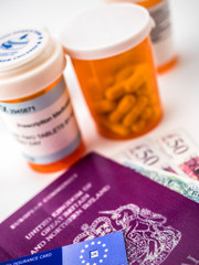 British passport along with several bottles of medicines, concept of medical increase in the crisis of the brexit, conceptual image