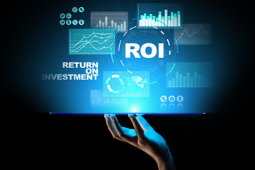 ROI - Return on investment, Trading and financial growth concept on virtual screen.