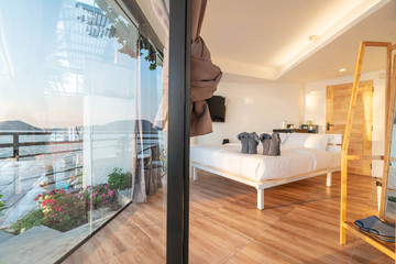 Interior design in bedroom of pool villa with  elephant towel ,golden lighting sunset