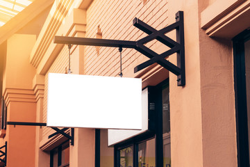 horizontal black empty signage on clothes shop front with copy space.