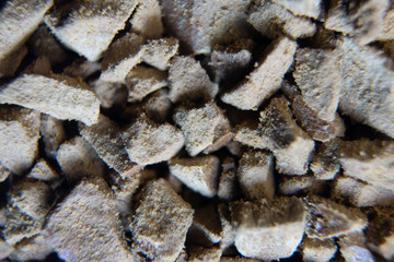 Piled granules texture background macro shot. Instant coffee close-up macro background