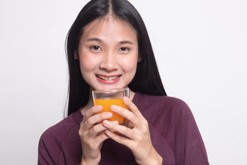 Young Asian woman drink orange juice.
