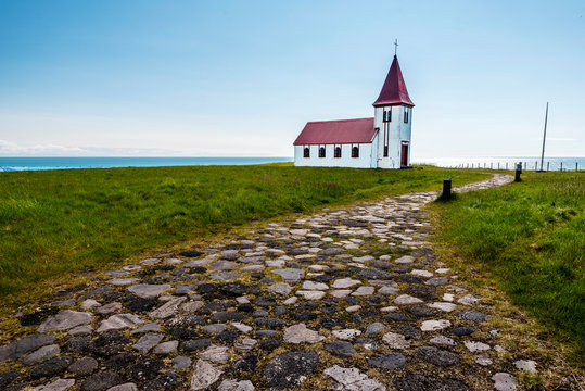 Pebble paved walk pass to Hellnar church in Snaefellsnes peninsula of Western Iceland.