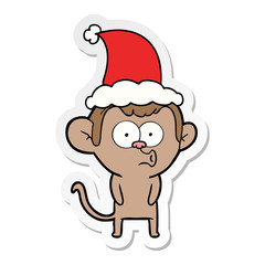 sticker cartoon of a hooting monkey wearing santa hat