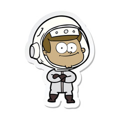 Obraz premium sticker of a happy astronaut cartoon