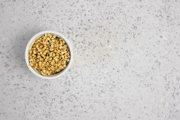 Green germinated buckwheat on grey backround. Raw buckwheat. Useful food from buckwheat sprouts for vegetarian food.