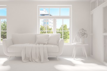 Stylish room in white color with sofa and green landscape in window. Scandinavian interior design. 3D illustration