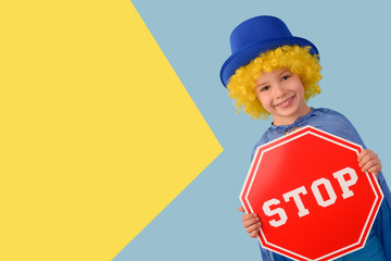 Little boy with a stop sign. Space for text