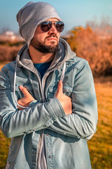 Portrait of young posing in casual and modern clothing in the park