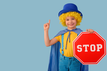 Little boy with a stop sign. Space for text
