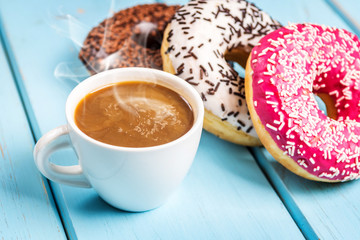 Sweet donuts on black stone table