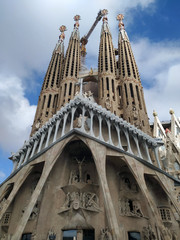 Facade of the Basilica Sagrada Familia in Barcelona, Spain. The great cathedral was under maintenance and the picture was shot on a sunny autumn day. 