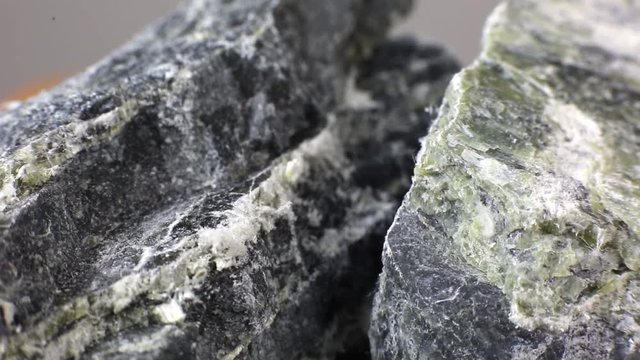 Mineral asbestos macro video. Harmful, dangerous minral. Asbestos fibers in rock close-up.