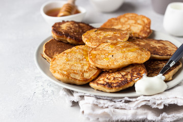 Buckwheat pancakes with honey and sour cream. Breakfast or brunch. Gluten free pancakes.