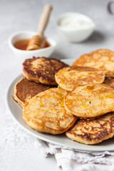 Buckwheat pancakes with honey and sour cream. Breakfast or brunch. Gluten free pancakes.