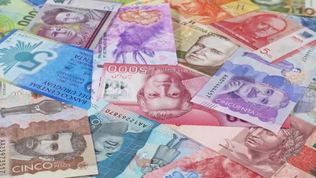 South America currency notes rotating. South American money, trade, economy, market. Low angle. 4K stock video footage