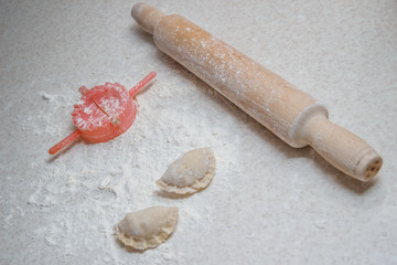 Appetizing dumplings, vareniki, ravioli, momo close-up. Boiled dough with filling. Traditional dish of Ukraine, Italy, Asia. Dumplings with meat, fish, vegetables. A hearty breakfast, lunch, dinner.