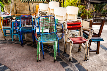 pile of colored iron chairs