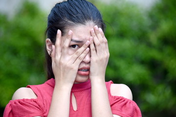 Youthful Asian Teenager Girl Afraid