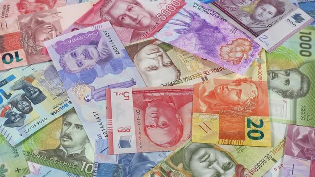 South America currency banknotes rotating. South American money, trade, economy, market. Low angle. 4K stock video footage