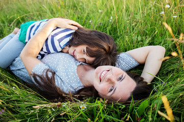  mother and child are having fun in the mountains