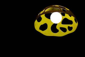 Lamp with yellow shade on the black background