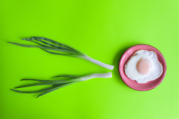 Fried egg on a bright background, cheerful breakfast