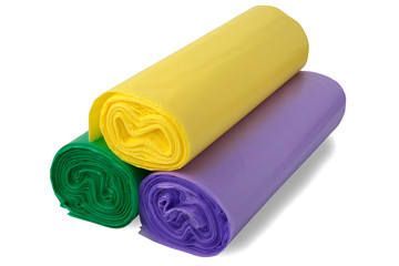 Three coloful rolls of polythene bags. Concept view. Set of plastic polyethylene trash bags roll isolated over the white background