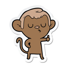 Obraz na płótnie Canvas sticker of a cartoon calm monkey