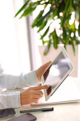 The girl touches the screen with her finger