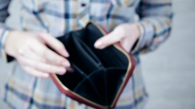 empty wallet - woman with no money in purse shopping