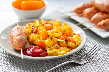 Stewed vegetables with turmeric and cumin and turkey kebab