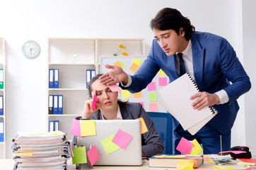 Two colleagues employees working in the office 