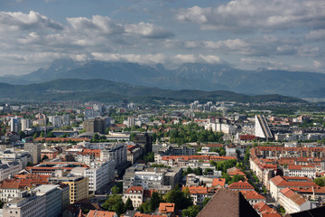 Naklejka na ściany i meble Overview of Ljubljana capital city of Slovenia with Mount Saint Mary and distant Kamnik Savinja Alps mountains from the hilltop Ljubljana Castle