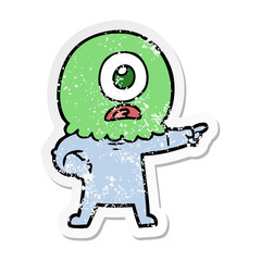 distressed sticker of a cartoon cyclops alien spaceman pointing