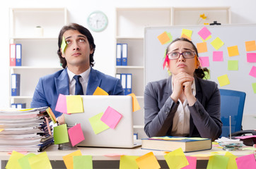 Two colleagues employees working in the office 