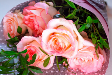 Bouquet of pink roses on light background, greeting card, place for text.