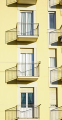 Obraz premium yellow buildings with small balconies