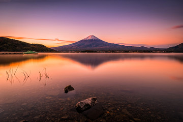 Naklejka na ściany i meble Landscape image of Mt. Fuji over Lake Kawaguchiko at sunrise in Fujikawaguchiko, Japan.