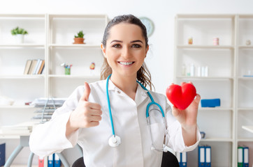 Young female doctor cardiologist working in the clinic 