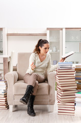 Young female student preparing for exams at home 