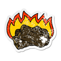 distressed sticker of a quirky hand drawn cartoon burning log