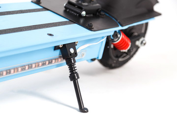 Electric kick scooter stand close up on white
