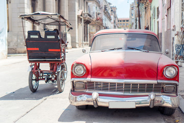 View of yellow classic vintage car in Old Havana, Cuba