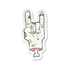 retro distressed sticker of a cartoon zombie hand
