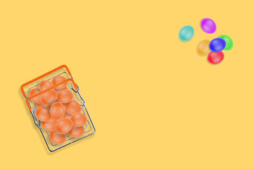 One full glossy metal market basket of fresh raw brown eggs on yellow table on kitchen. Top view. Business concept. Copy space for your text