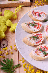 Crepes rolls with cream cheese and salmon cut into pieces