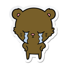 sticker of a crying cartoon bear